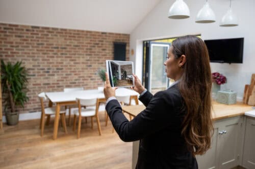 single mom real estate agent taking photo